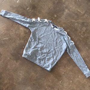 Grey sweater with white crosses